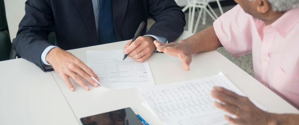 Buyer and advisor reviewing pre-purchase property reports