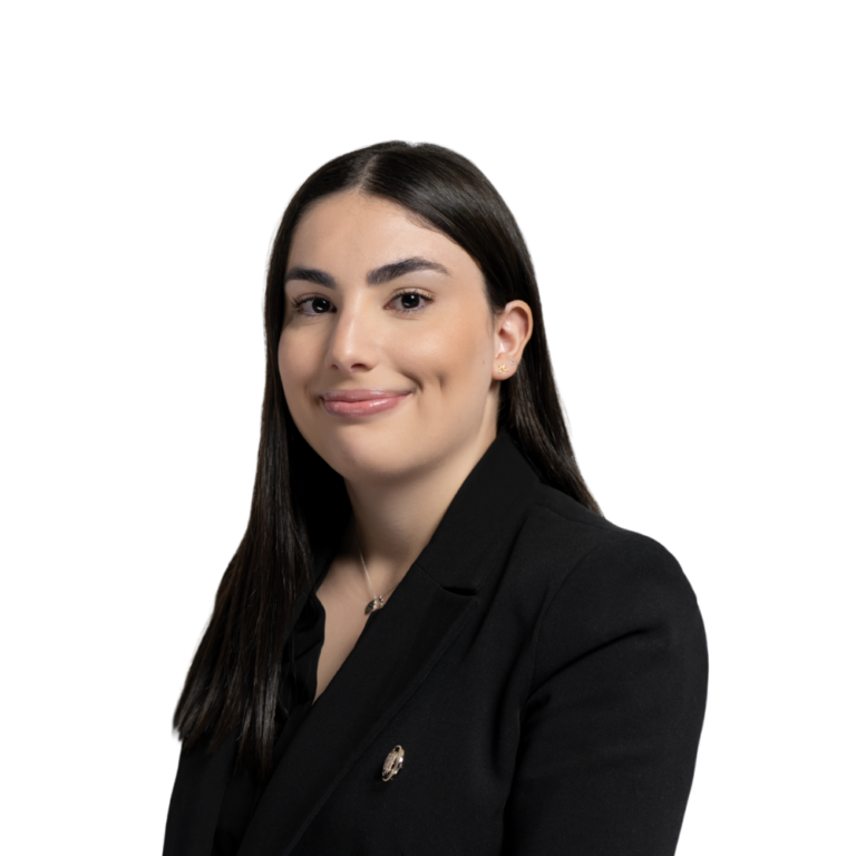 Professional woman in black business suit smiling