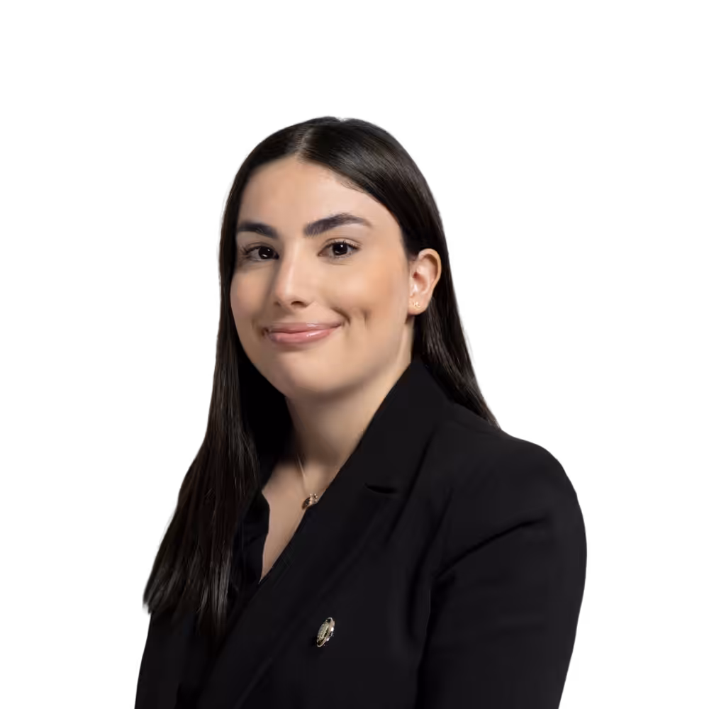 Professional woman in black business suit smiling