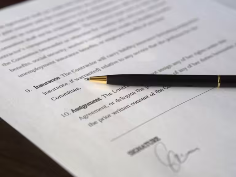 Insurance document with a pen placed on top representing contract review