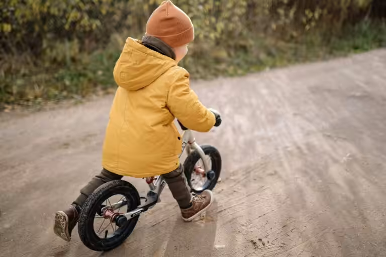 Young child playing with a small bike, representing family law matters