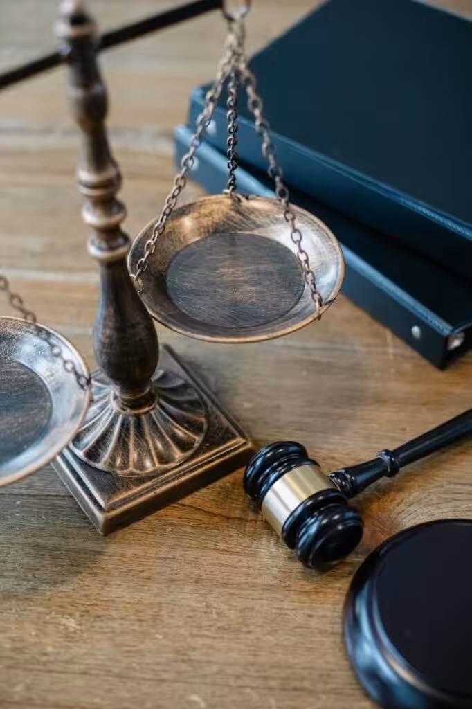 Scales of justice and gavel on desk