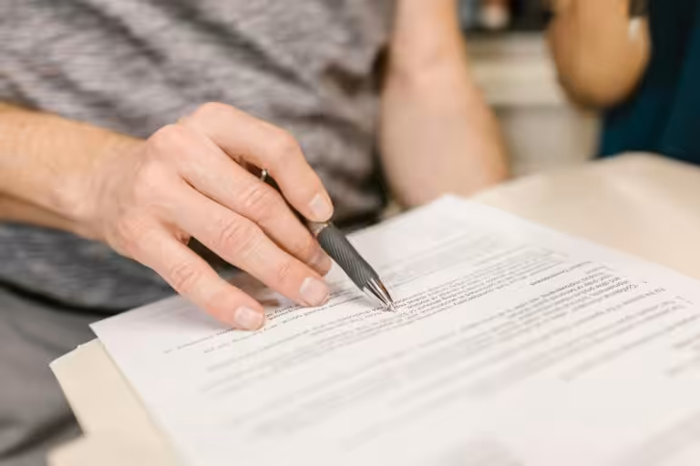 Man signing a legal document