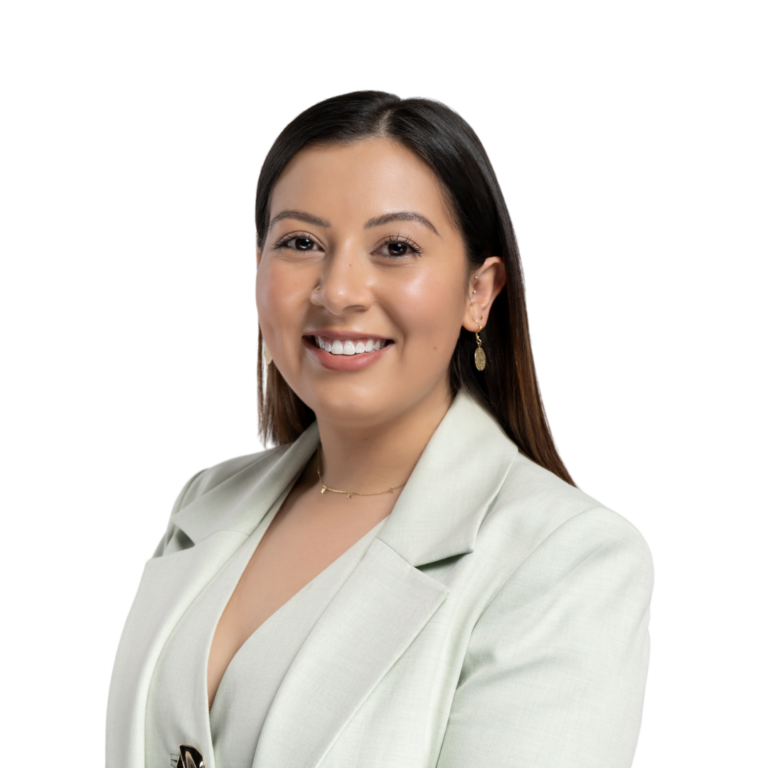 Professional woman smiling in light green blazer