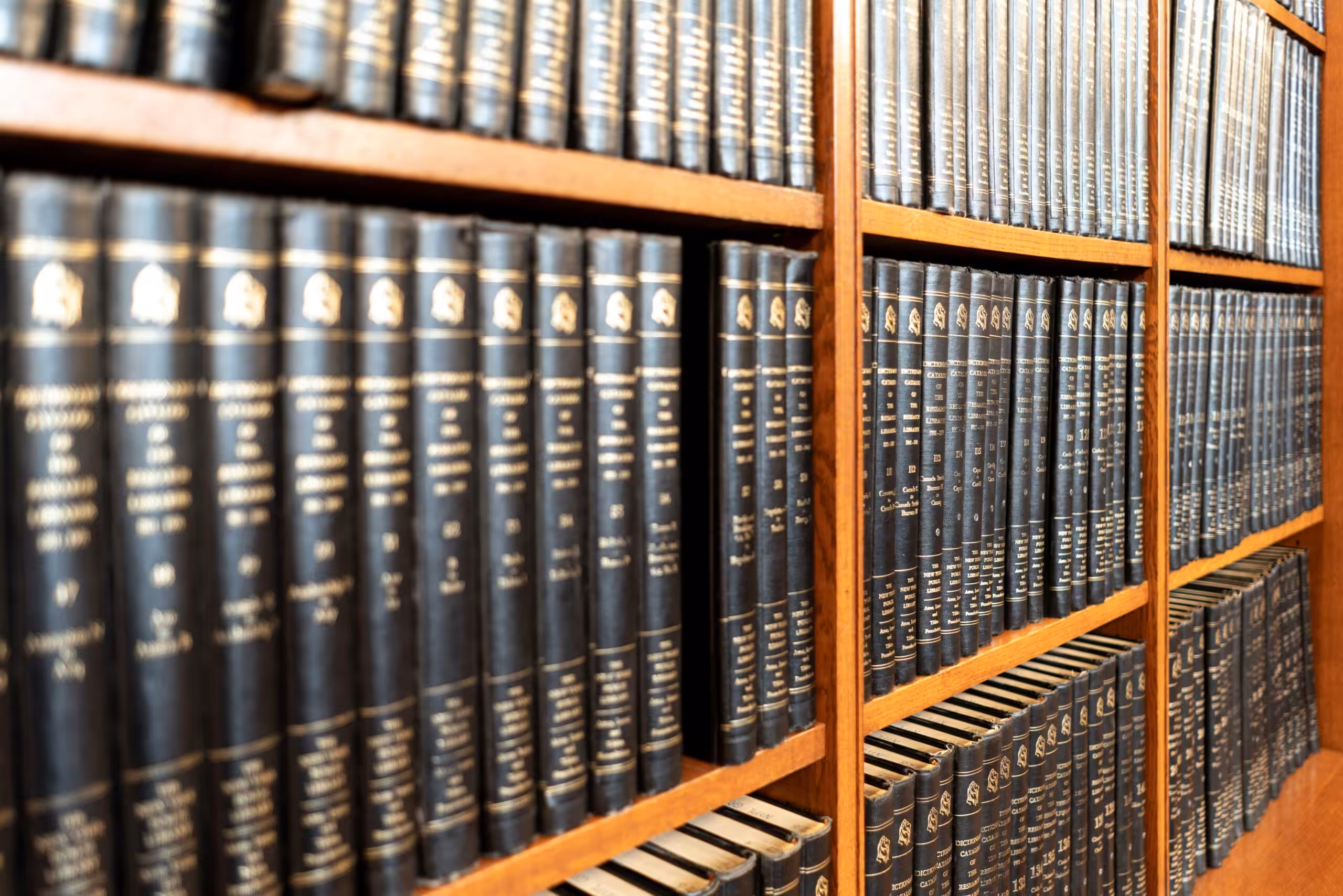 Bookshelf filled with encyclopaedia volumes