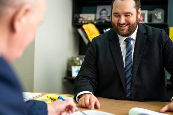 Business meeting discussing documents in office