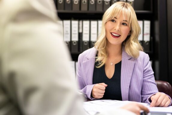 Smiling businesswoman in office meeting
