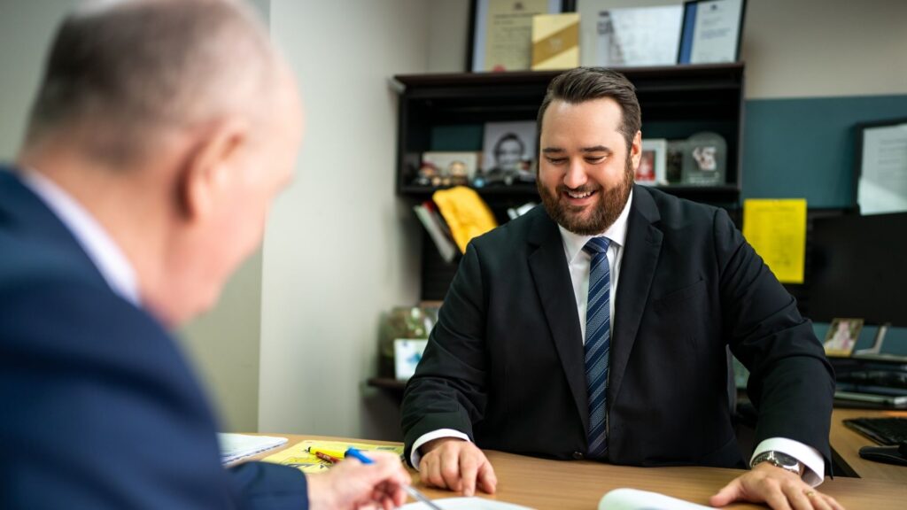 Businessmen discussing documents in office meeting