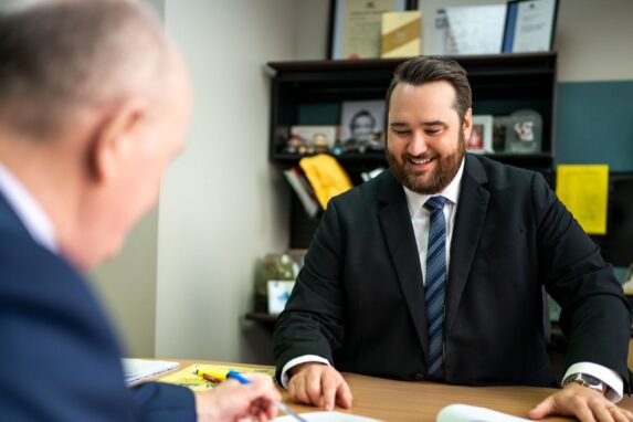 Businessmen discussing documents in office meeting