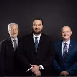 Professional group photo of lawyers Michael Battersby, Daniel McKinnon and John Bateman in Penrith.