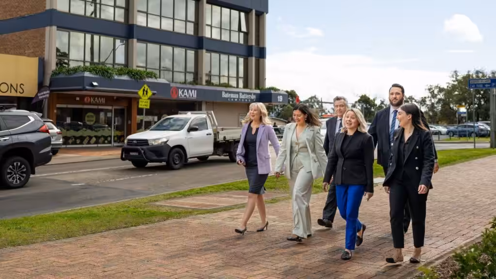 Law firm team walking outside the office, serving clients across Western Sydney.