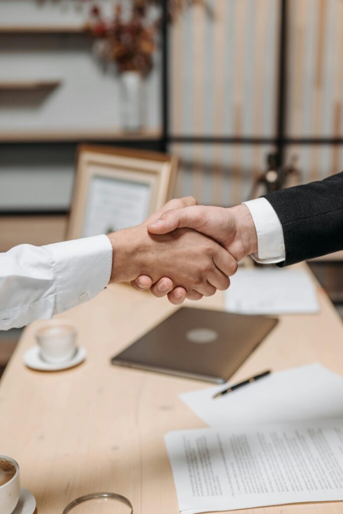 Business handshake closing successful deal